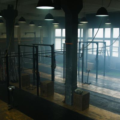 A quiet, empty space with a single mat on the floor.